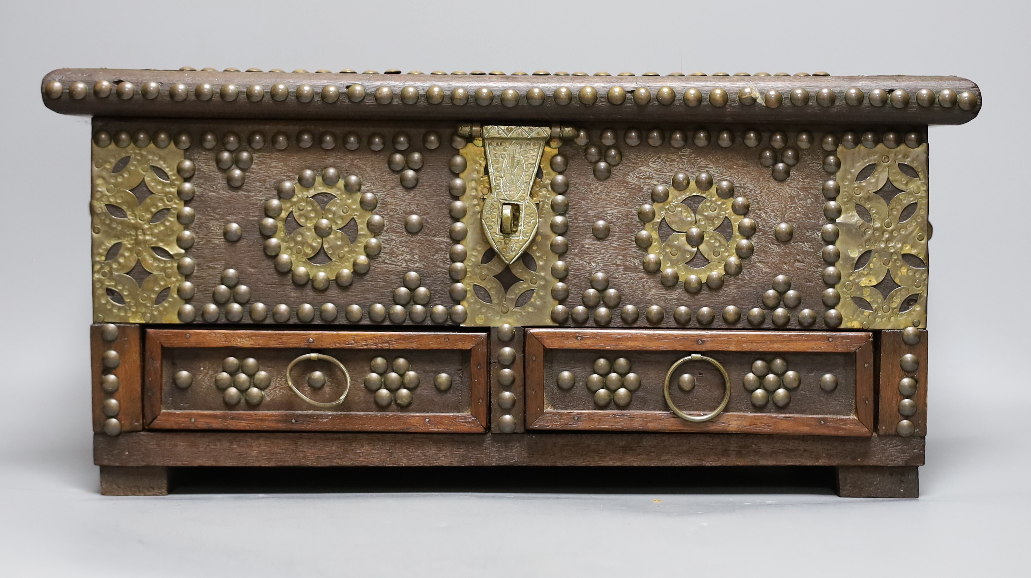 An Indian brass studded and mounted box, 45cms wide x 21cms high